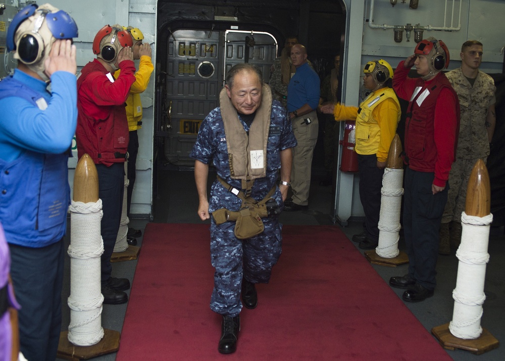 Multinational distinguished visitors aboard USS Peleliu