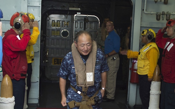 Multinational distinguished visitors aboard USS Peleliu