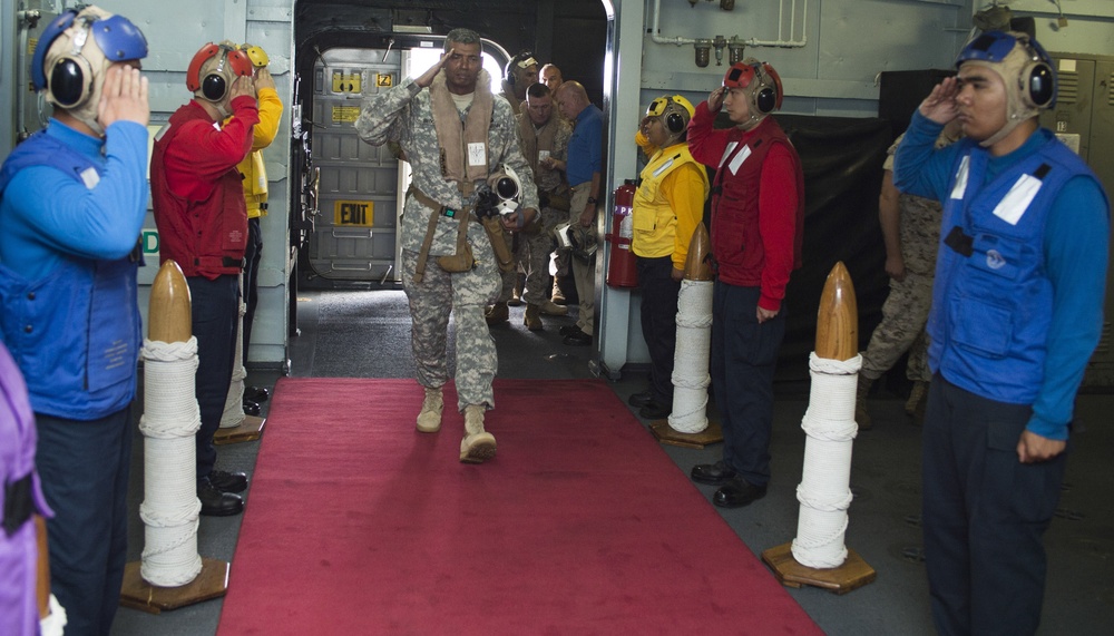 Multinational distinguished visitors aboard USS Peleliu