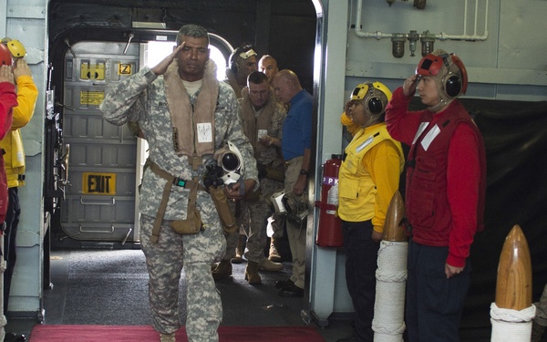 Multinational distinguished visitors aboard USS Peleliu