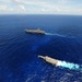 USS Reagan maneuvers with LCS