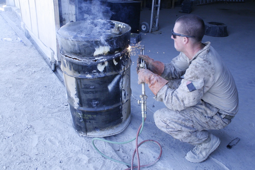 1/2 Motor transport Marines aid Camp Leatherneck while retrograding vehicles home