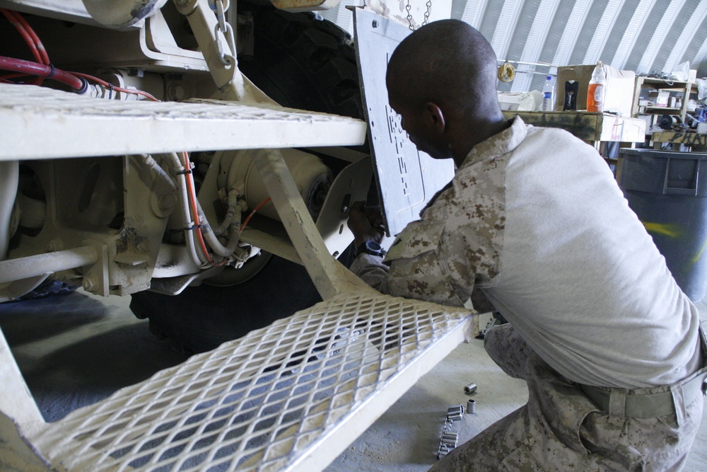 1/2 Motor transport Marines aid Camp Leatherneck while retrograding vehicles home