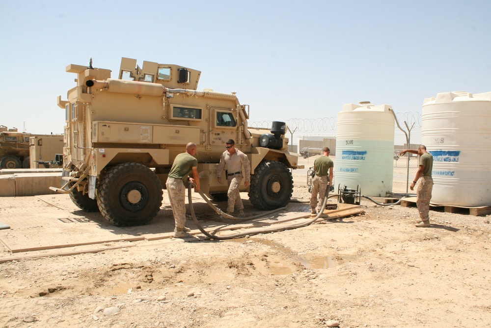 1/2 Motor transport Marines aid Camp Leatherneck while retrograding vehicles home