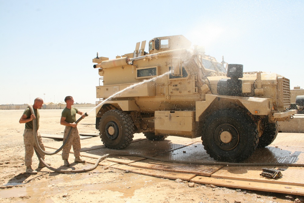 1/2 Motor transport Marines aid Camp Leatherneck while retrograding vehicles home