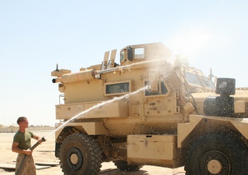 1/2 Motor transport Marines aid Camp Leatherneck while retrograding vehicles home