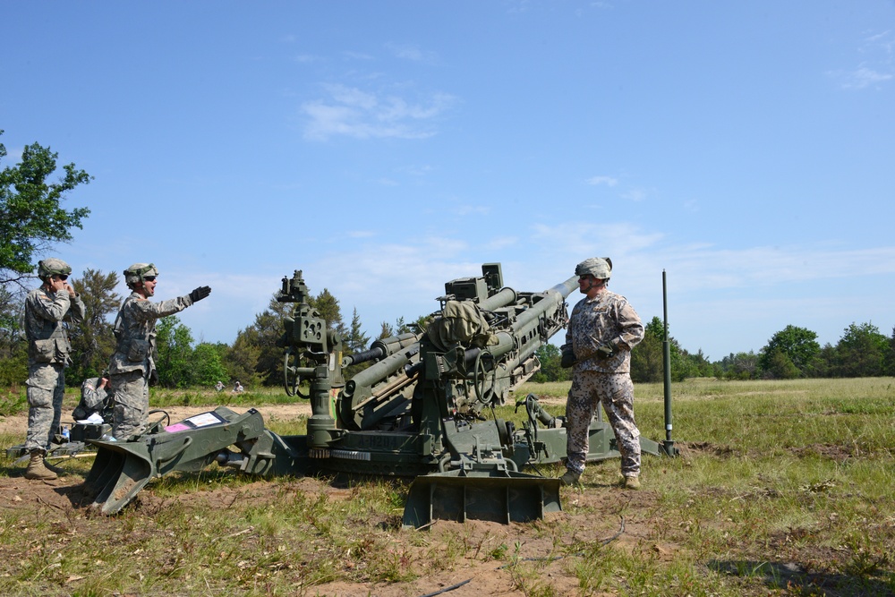 Latvian Chief of Defense Lt. General Graube fires an M777A1 during 119 FA's live fire exercise