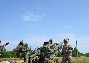 Latvian Chief of Defense Lt. General Graube fires an M777A1 during 119 FA's live fire exercise