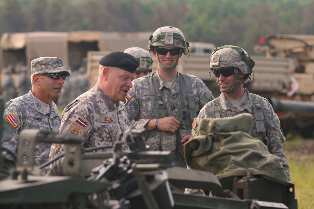 Maj. Gen. Gregory J. Vadnais, Adjutant General and Director of Military and Veterans Affairs for the Michigan National Guard, and Lt. Gen. Raimonds Graube, Latvian Chief of Defense, visit 119 FA at Camp Grayling, Michigan