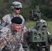 Lt. Gen. Raimonds Graube, Latvian Chief of Defense, observes the information display screen on an M777A1 howitzer of Alpha Battery, Ist Battalion, 119th Field Artillery Regiment