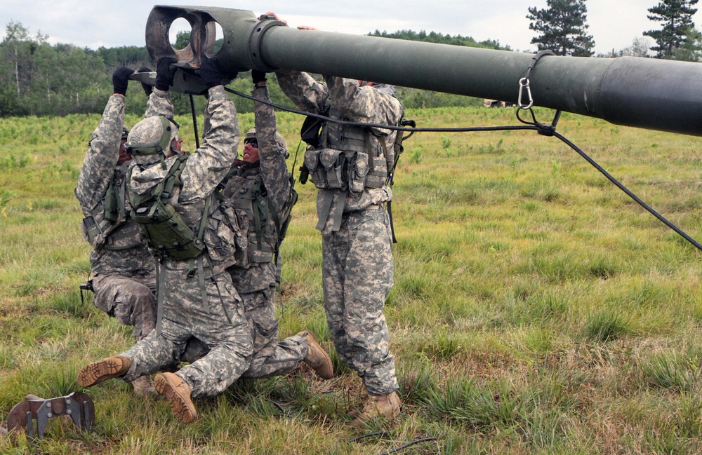 1-103rd Field Artillery perform position occupation at Camp Grayling, Michigan, during XCTC 2014