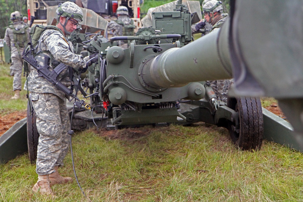 1-103rd Field Artillery perform position occupation at Camp Grayling, Michigan, during XCTC 2014