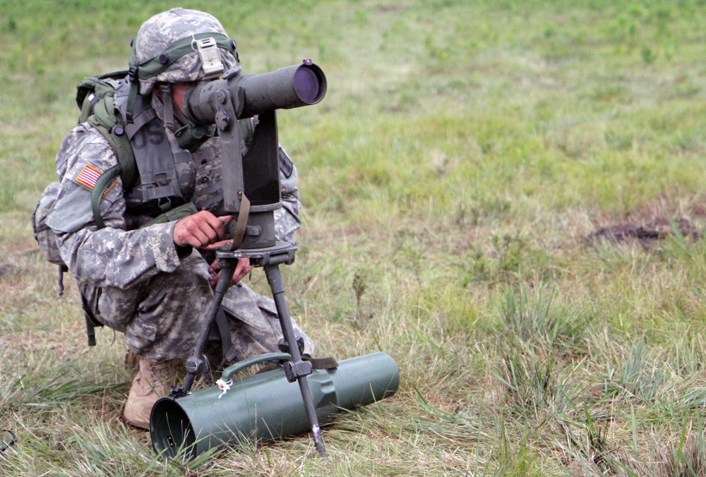 1-103rd Field Artillery perform position occupation at Camp Grayling, Michigan, during XCTC 2014