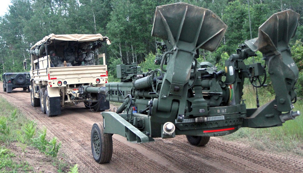 1-103rd Field Artillery perform position occupation at Camp Grayling, Michigan, during XCTC 2014