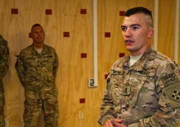 Father promotes son in combat zone, a rare opportunity