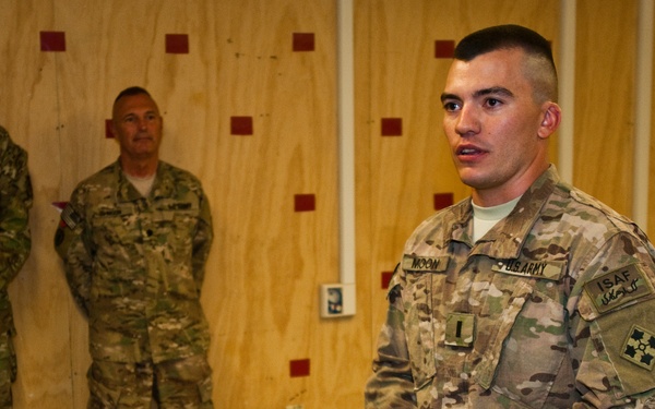 Father promotes son in combat zone, a rare opportunity