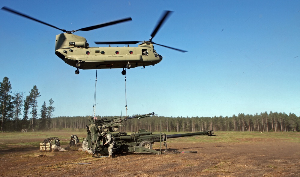 1-119 Field Artillery raid exercise breaks CGJMTC round distance charge record at XCTC 2014, Camp Grayling, Michigan