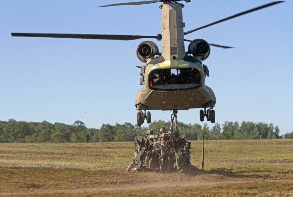 1-119 Field Artillery raid exercise breaks CGJMTC round distance charge record at XCTC 2014, Camp Grayling, Michigan