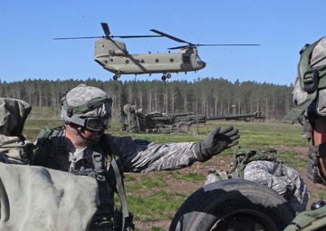 1-119 Field Artillery raid exercise breaks CGJMTC round distance charge record at XCTC 2014, Camp Grayling, Michigan