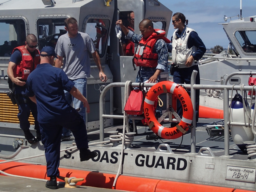 Coast Guard, Navy crews assist ailing fisherman