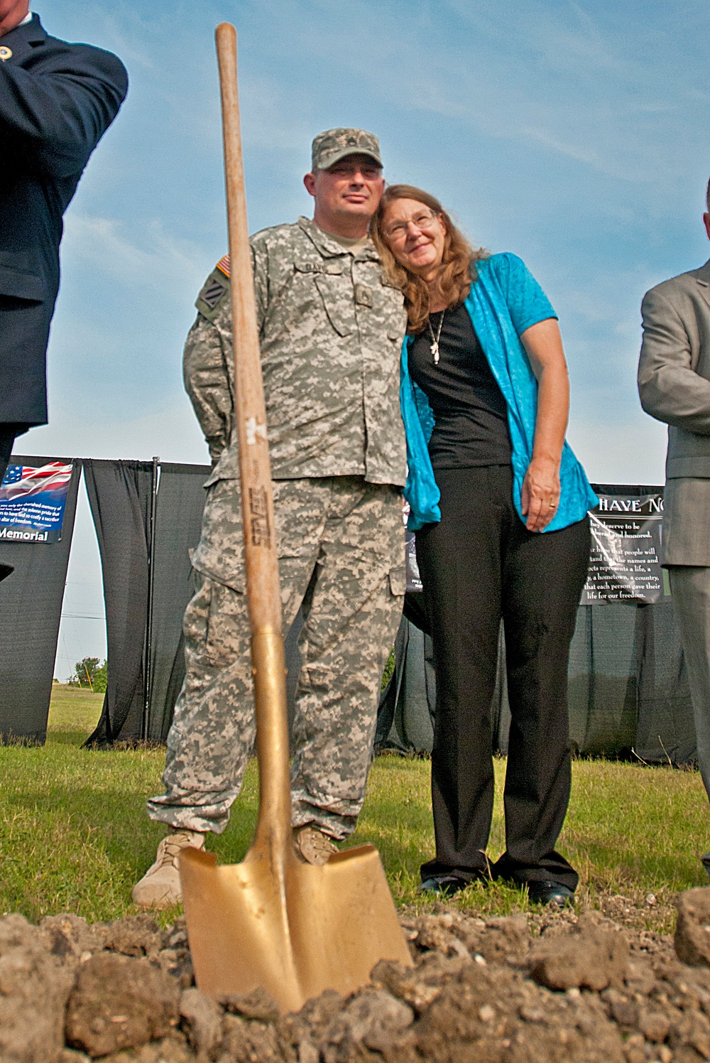 Wounded Soldier and survivor embrace at the November 5, 2009 Fort Hood Shooting Memorial groundbreaking ceremony