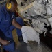 Coast Guard member conducts oil checks