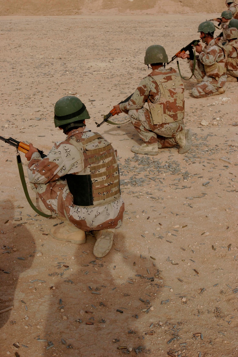 Iraqi soldiers fire weapons at rifle range in Al Qaim