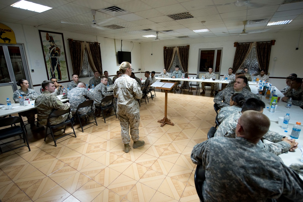 CJTF-HOA senior enlisted leader speaks to students during Corporal's Leadership Course Class Mess Night