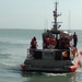 Coast Guard brings rescued kayakers to safety