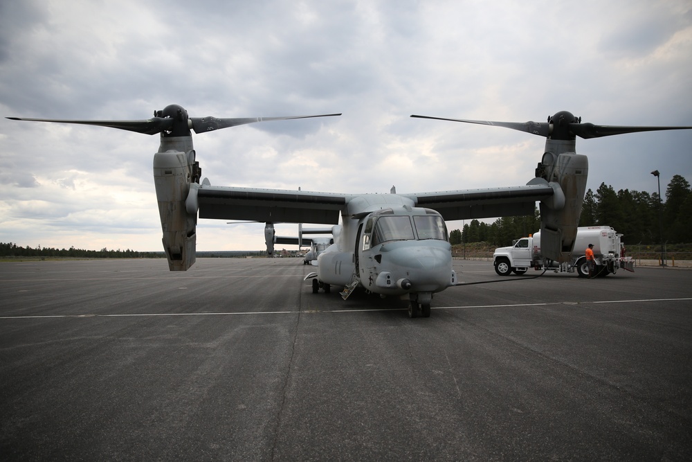 MV-22B Ospreys fly over various terrain for tactical training