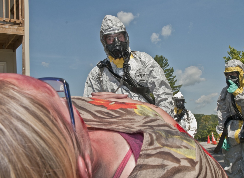 Soldier takes role-player to DECON line