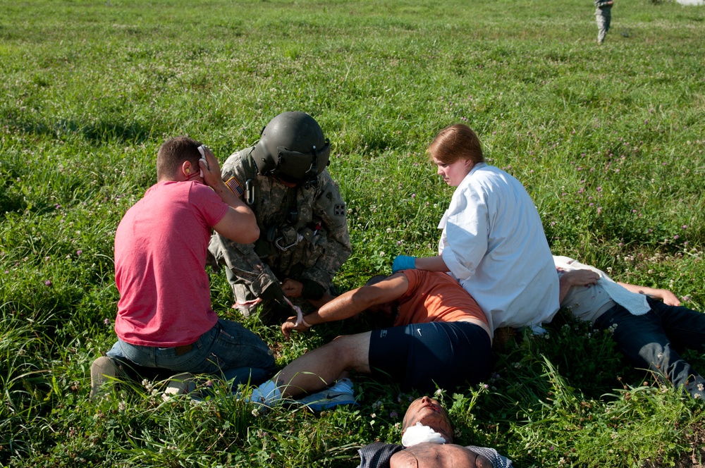 Flight medic assesses wounded