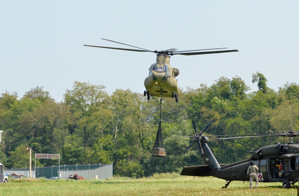 A CH-47 Chinook helicopter drops a simulated sling load