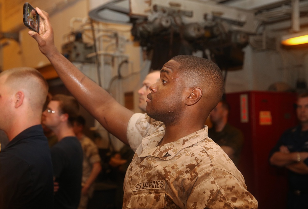 Marines and Sailors enjoy live entertainment aboard the Bataan