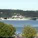 The Wasp-class amphibious assault ship USS Essex (LHD 2) passes the Mukilteo Lighthouse on her way to Naval Station Everett