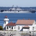 The Wasp-class amphibious assault ship USS Essex (LHD 2) passes the Mukilteo Lighthouse on her way to Naval Station Everett