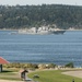 he Arleigh Burke-class destroyer USS Howard (DDG 83) passes the Mukilteo Lighthouse park on her way to Naval Station Everett