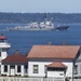 The Arleigh Burke-class destroyer USS Howard (DDG 83) passes the Mukilteo Lighthouse on her way to Naval Station Everett