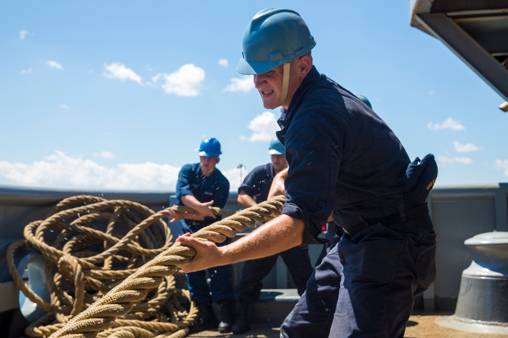 USS Kearsarge Sailors haul in mooring line