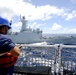 PLA(N) Yueyang and USCG Waesche conduct a hand-line transfer during RIMPAC 2014