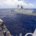 PLA(N) Yueyang and USCG Waesche conduct a hand-line transfer during RIMPAC 2014