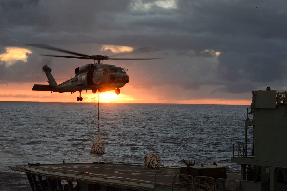 HMAS success conduct transfer operations with USCG Cutter Waesche