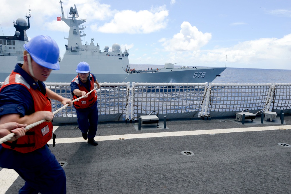 USCG Waesche conduct a hand-line transfer with PLA(N) ship Yueyang during RIMPAC 2014