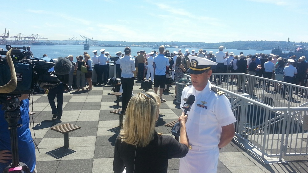 Lt. Dru Nelson, Everett, Wash., native and command chaplain aboard USS Chancellorsville (CG 62), conducts an interview with a local television reporter during the Seattle Seafair Fleet Week Parade of Ships