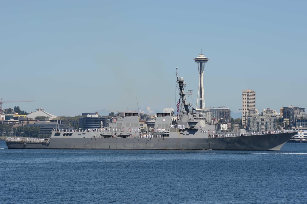 The Arleigh Burke-class destroyer USS Howard (DDG 83) transits Elliott Bay during a parade of ships to kickoff Seattle Seafair week