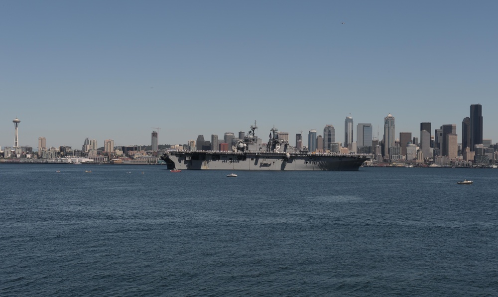 The Wasp-class amphibious assault ship USS Essex transits Elliott Bay during a parade of ships to kick off Seafair week