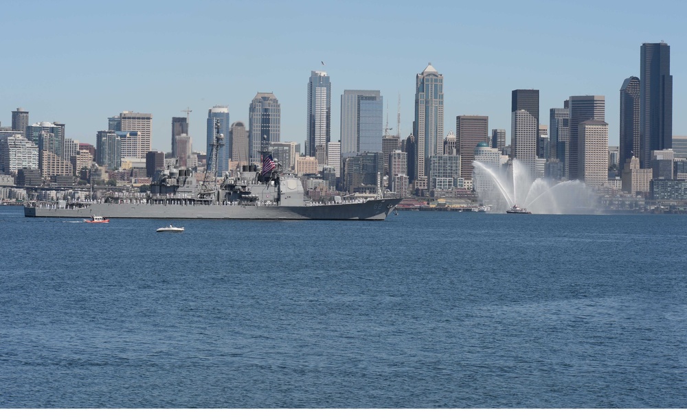 The Ticonderoga-class guided-missile cruiser USS Chancellorsville (CG 62) transits Elliott Bay during a parade of ships to kickoff Seafair week