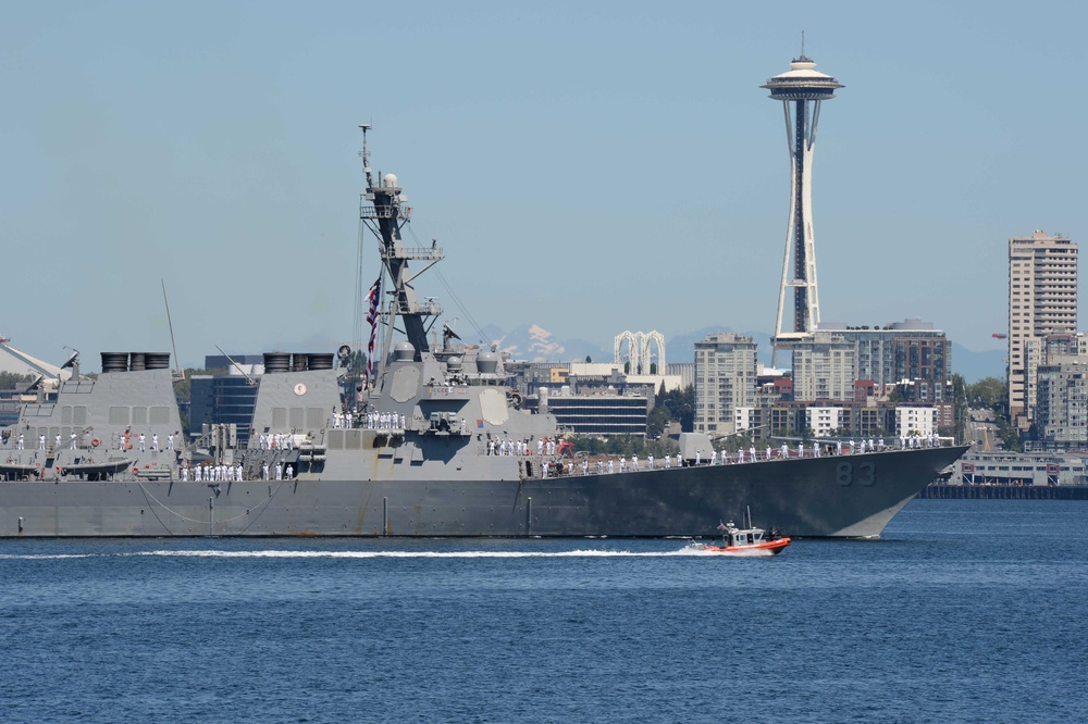 The Arleigh Burke-class destroyer USS Howard (DDG 83) transits Elliott Bay during a parade of ships to kickoff Seafair week