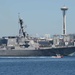 The Arleigh Burke-class destroyer USS Howard (DDG 83) transits Elliott Bay during a parade of ships to kickoff Seafair week