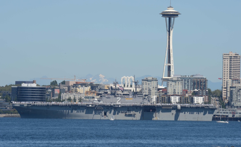 The Wasp-class amphibious assault ship USS Essex (LHD 2) transits Elliott Bay during a parade of ships to kickoff Seafair week